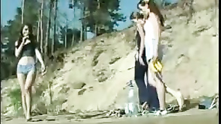 young girls play naked on the beach