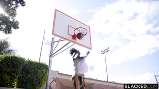 Teen On A Basketball Court